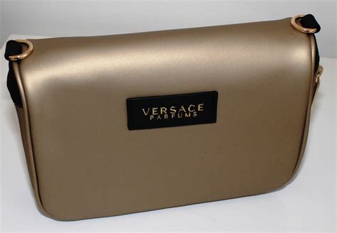 versace parfums gold clutch|Versace hobo bags.